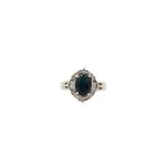 18 Carat White Gold Tanzanite & Diamond Halo Ring
